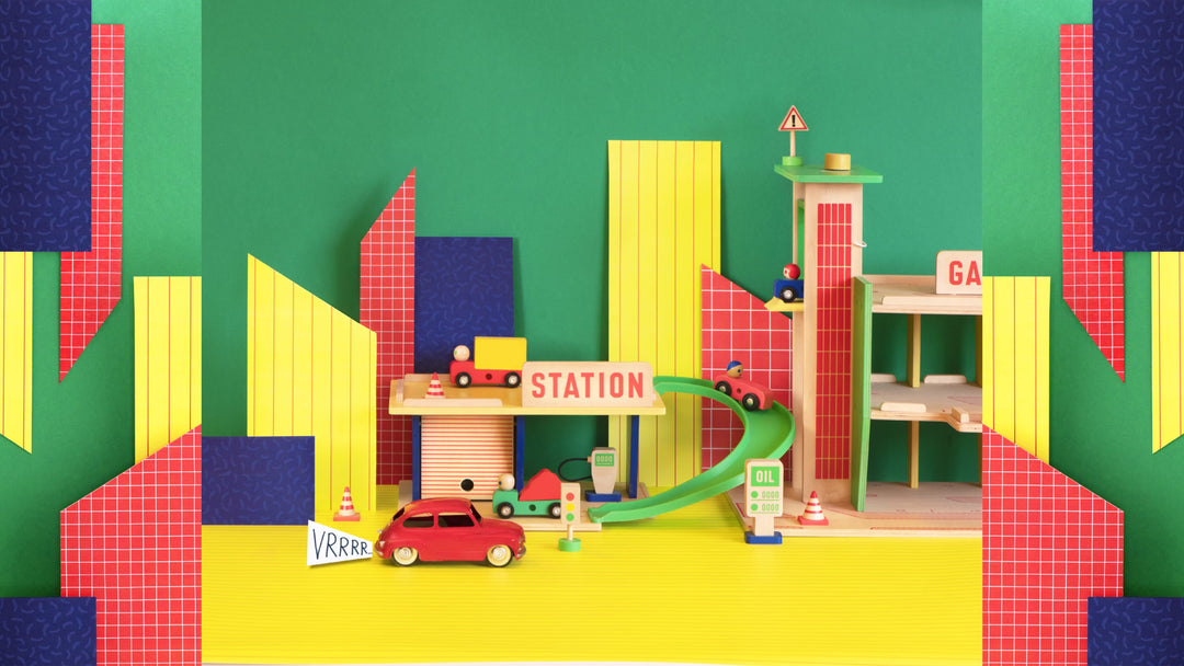 Collezione Dans la Ville di Moulin Roty per bambini con giochi in legno, macchine, cubi, blocchi, autobus, timbri.