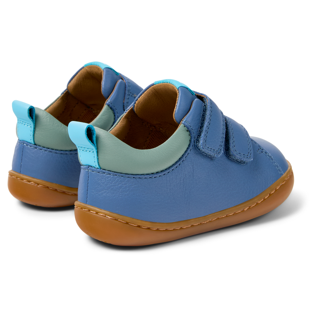 Scarpe in pelle blu, Peu primi passi