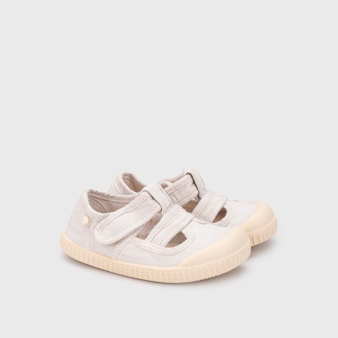 Open canvas shoes barefoot concept, Ice