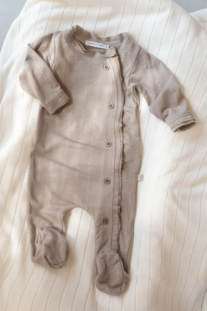 Side opening playsuit with organic bamboo feet, Sand