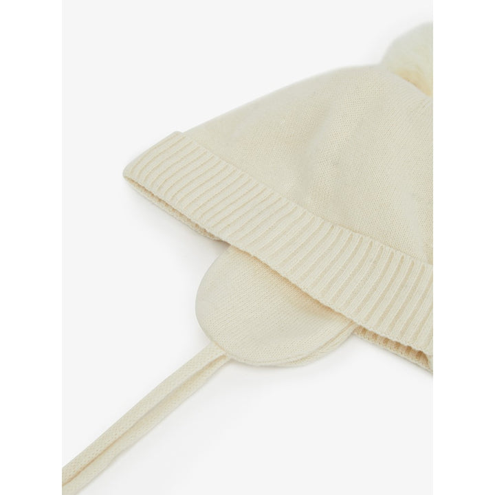 Cappello in cotone bianco con paraorecchie, 0-2 mesi