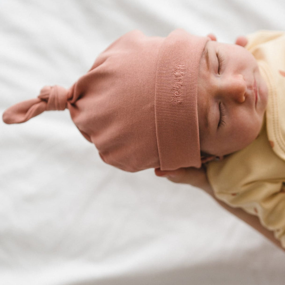 Cappellino neonato con nodo Apricot | Petit Oh! Pima Cotone